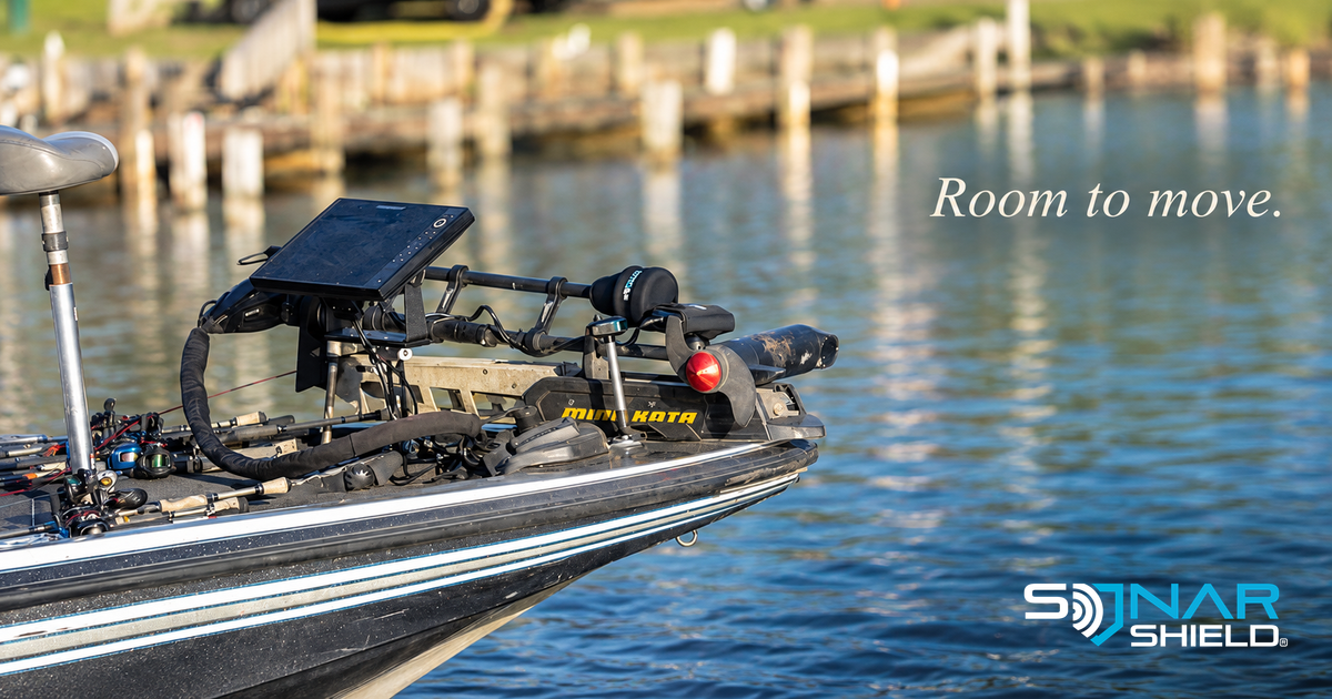 Boat bow with covered marine electronics and stowed trolling motor beside the words Room to move.